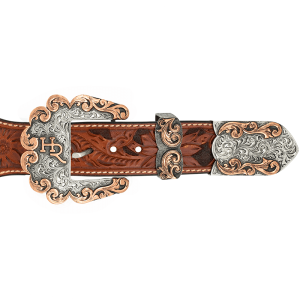 A custom western three piece betl buckle set featuring a personalized ranch brand and copper scrollwork edge 